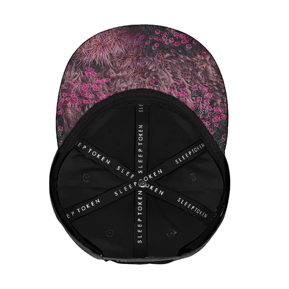 Cap with floral pattern on top and black back with brand name