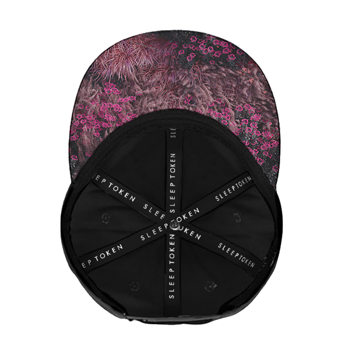 Cap with floral pattern on top and black back with brand name