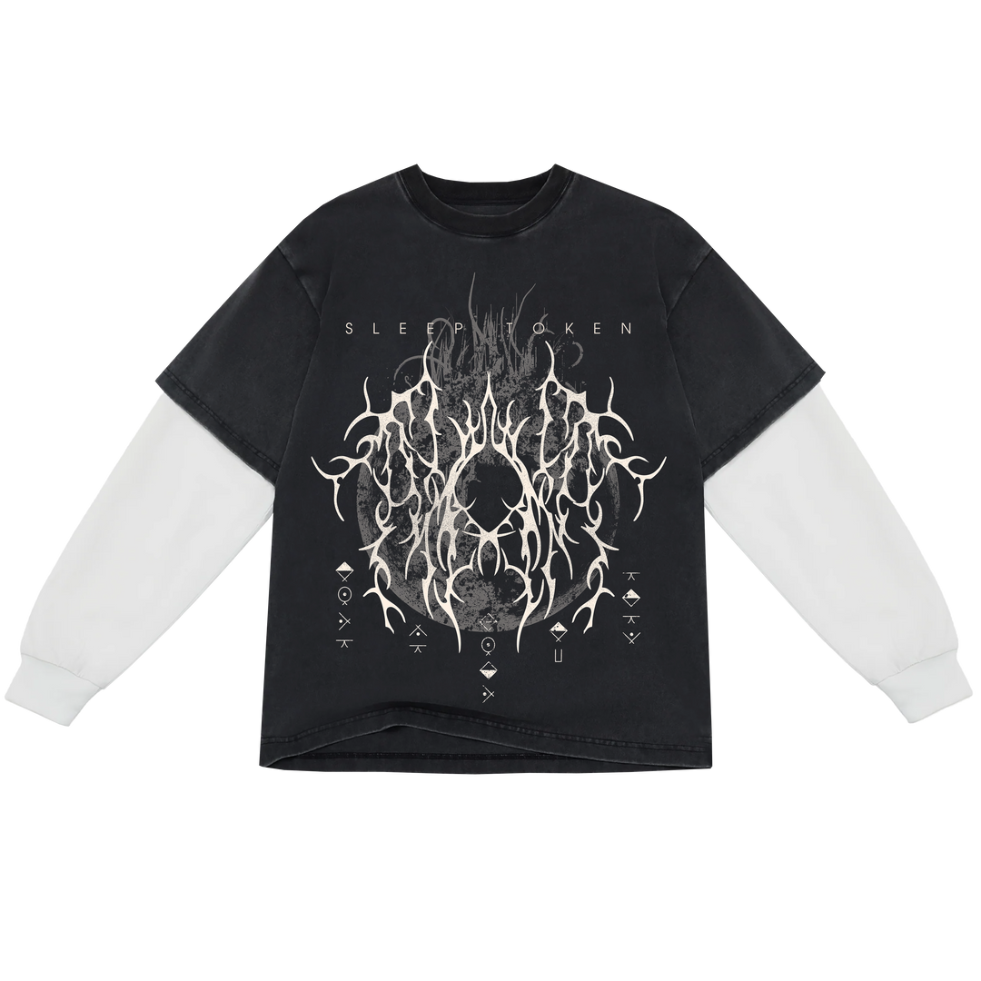A black long-sleeve t-shirt with a white graphic print , featuring the band name 'SLEEP TOKEN' printed in white text above the graphic. The shirt is displayed flat against a solid white background.