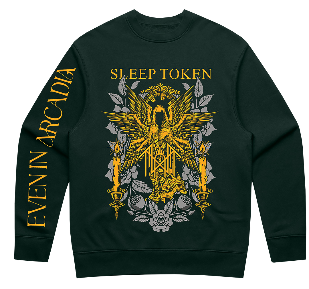 A dark forest green crewneck sweatshirt featuring a large graphic print on the front with a golden eagle, candles, and the text 'SLEEP TOKEN' in gold. The left sleeve features the text 'EVEN IN ARCADIA' in gold.